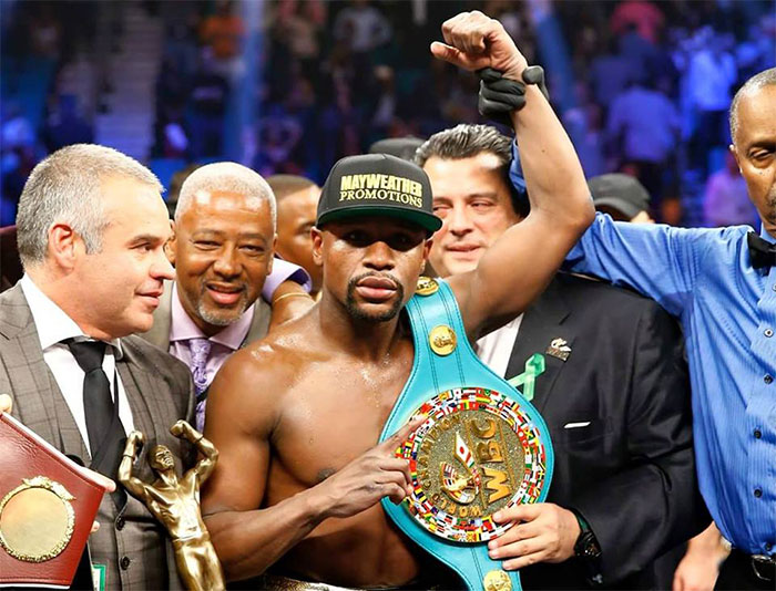 Floyd Mayweather wins the fight of the century. 