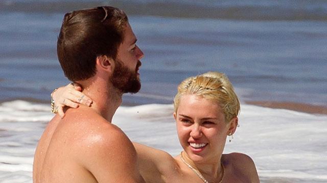Photos: Miley Cyrus goes tople$$ again with her boyfriend